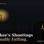 Editorial illustration of a warm streetlight glow over a Milwaukee porch at dusk, symbolizing community trust and violence prevention